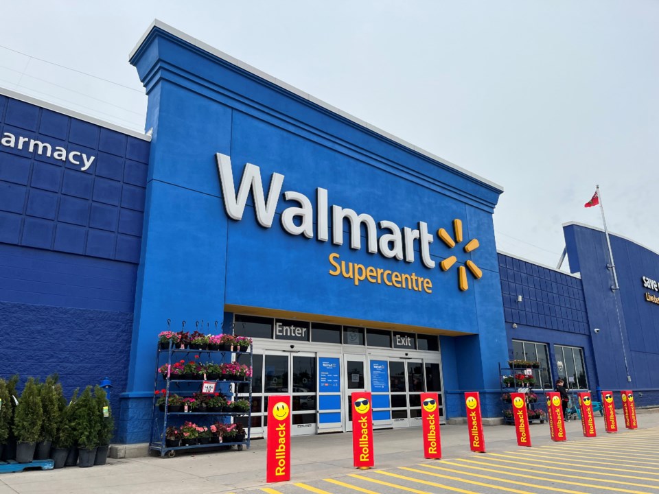 Walmart Supercentre blue entrance facade repainted to brand standard