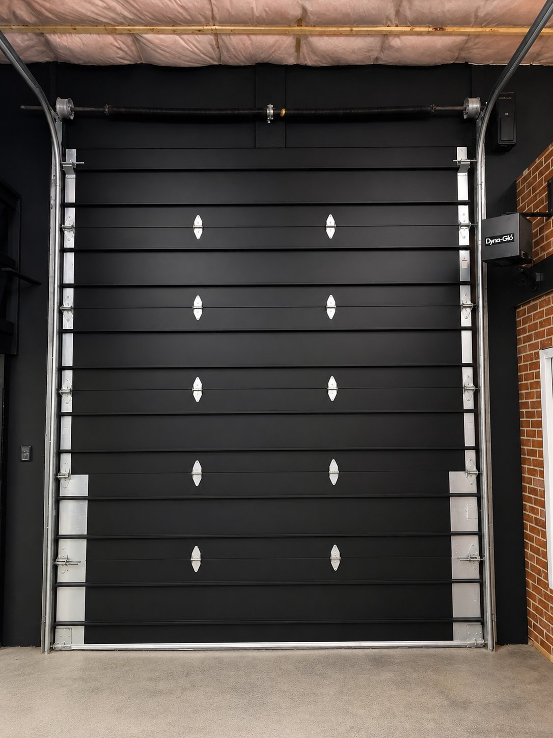Freshly coated commercial overhead door — Pentagon Group